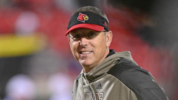 Nov 5, 2022; Louisville, Kentucky, USA; Louisville Cardinals head coach Scott Satterfield watches his players warm up before the first half against the James Madison Dukes at Cardinal Stadium. Louisville defeated James Madison 34-10. Mandatory Credit: Jamie Rhodes-USA TODAY Sports